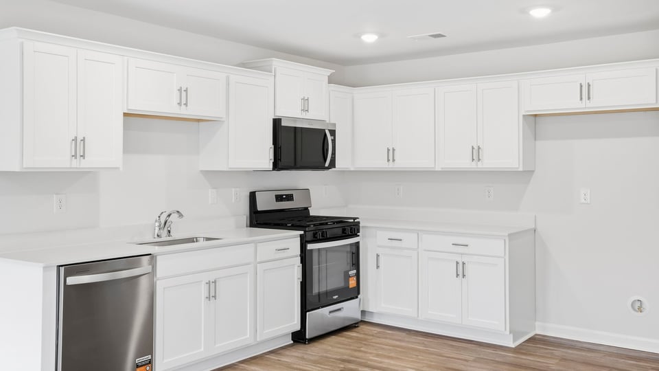 Kitchen with stainless steel appliances.