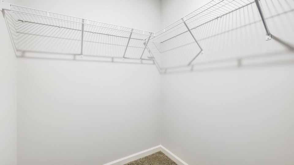 Closet with hanging storage racks.