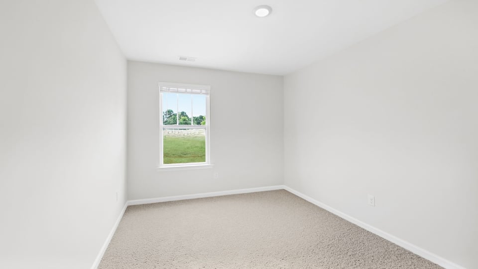 Bathroom with carpet and window.