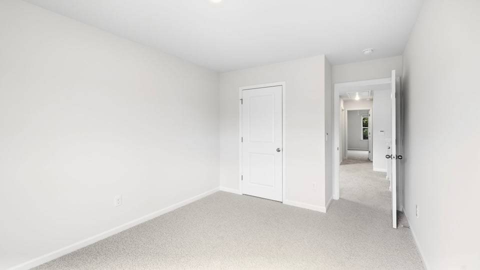 Bathroom with carpet and window.