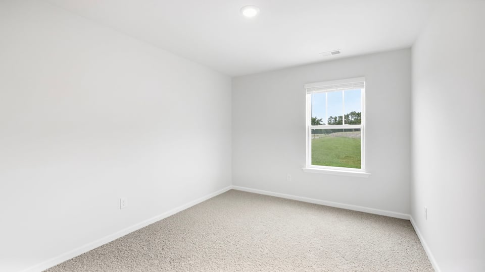 Bathroom with carpet and window.