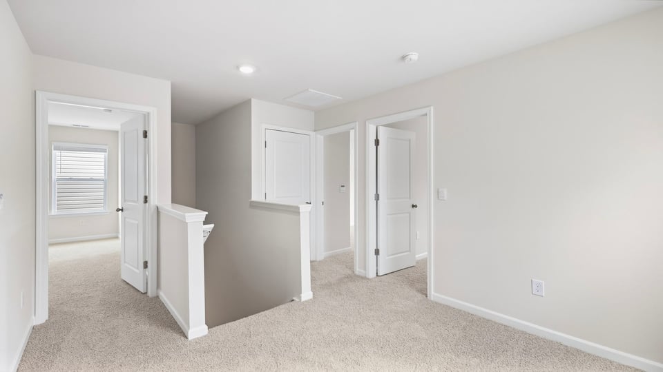 Loft area with carpet.