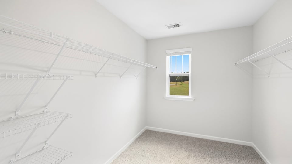 Closet with hanging storage racks.