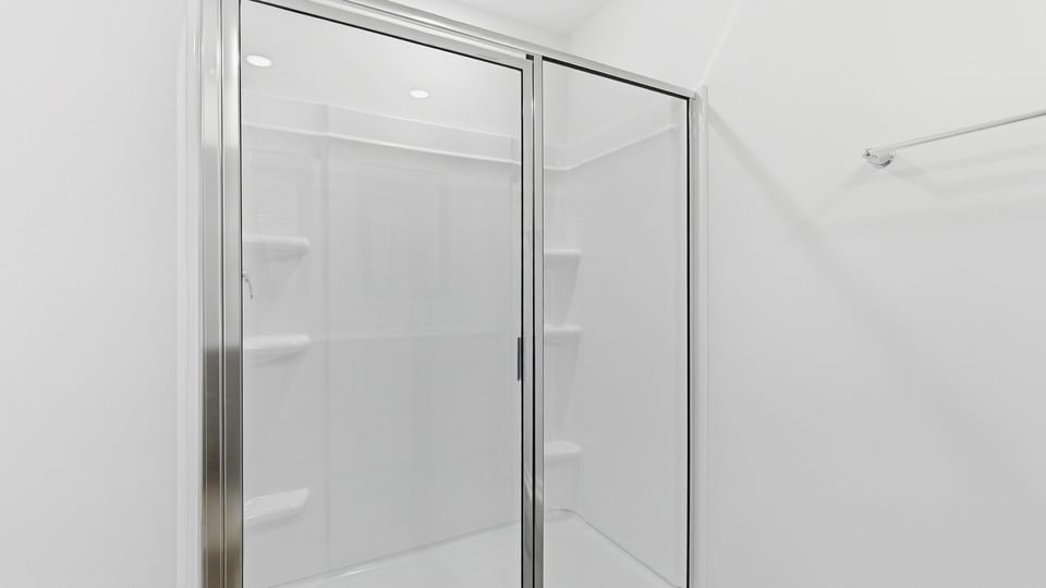 Bathroom with walk in shower.