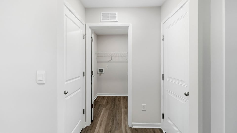 Closet with hanging storage racks.