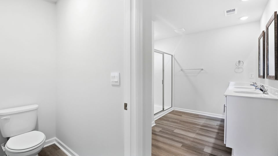 Bathroom with walk in shower and double vanity ink.