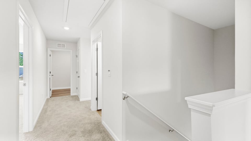 Loft area with carpet.