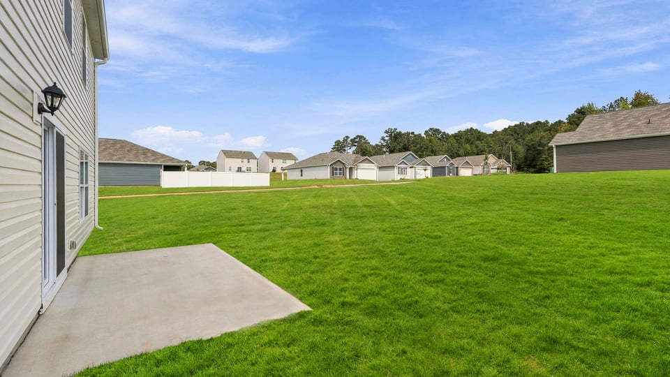 back exterior of home with patio.