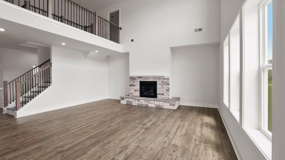 Living room with fireplace and window.