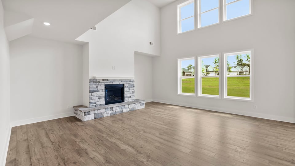 Living room with fireplace and window.