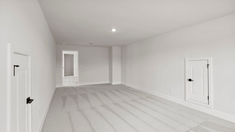 Bedroom with carpet and window.