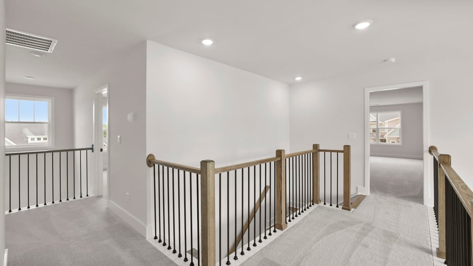 Loft area with carpet.