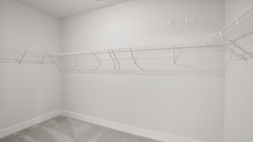 Closet with hanging storage racks.