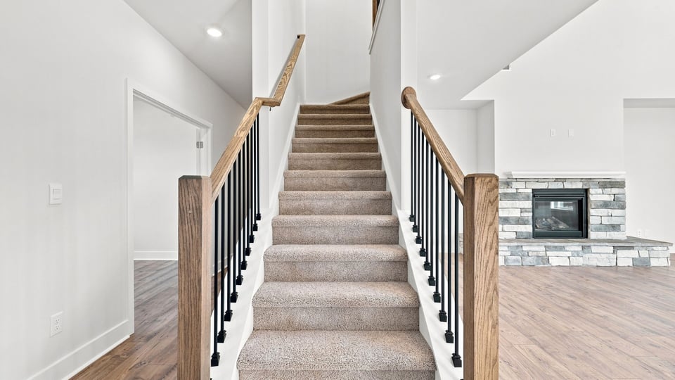 Stairs with carpet to berooms.