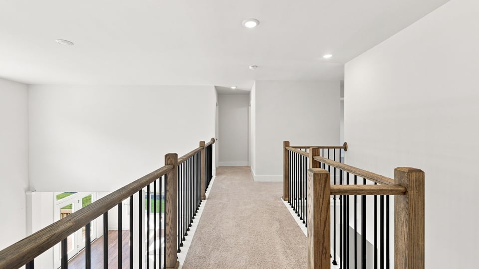 Hallway upstairs with carpet.