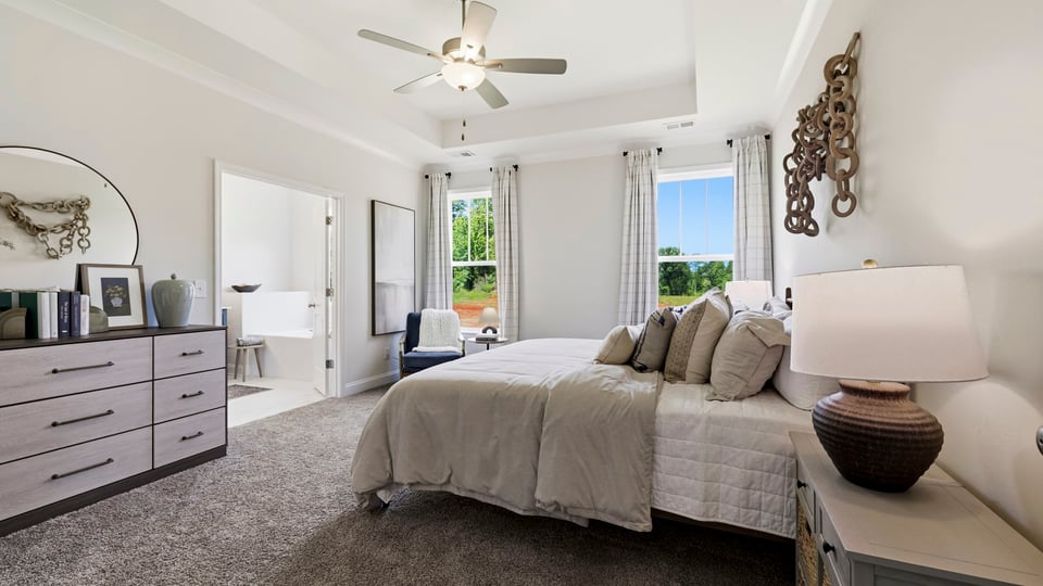 Bedroom with carpet and window.