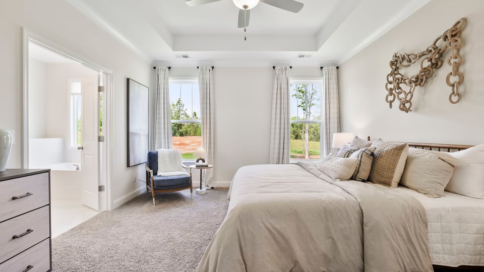 Bedroom with carpet and window.