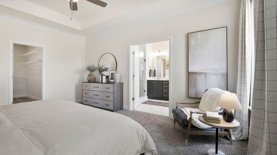 Bedroom with carpet and window.