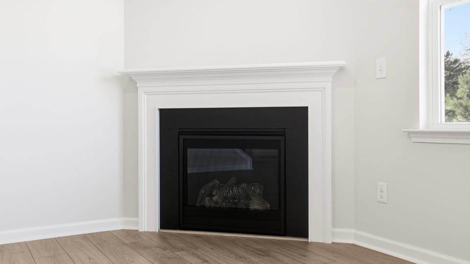 Living room with windows and fireplace.
