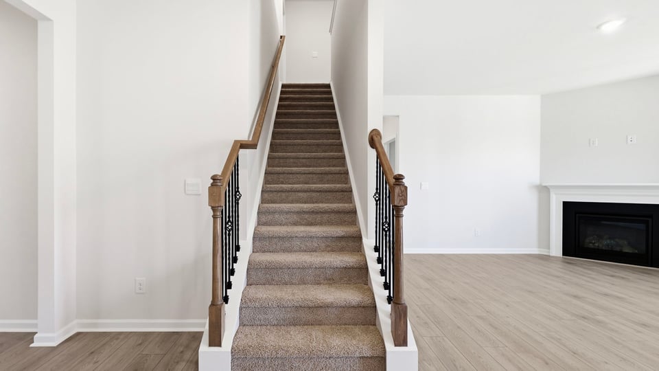 Stairs to additional bedrooms.