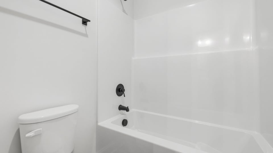 Bathroom with bathtub.