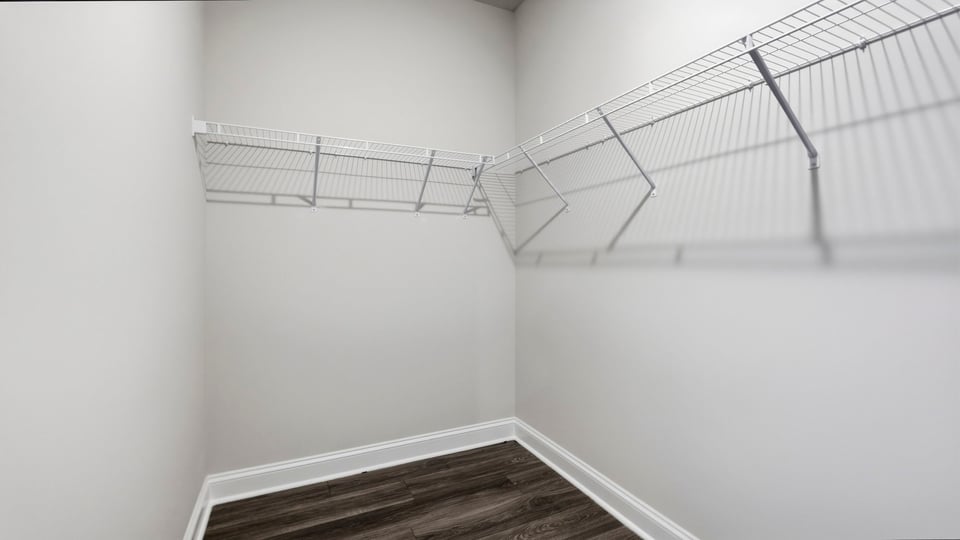 Closet with hanging storage racks.
