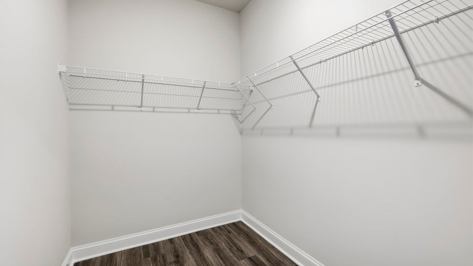 Closet with hanging storage racks.