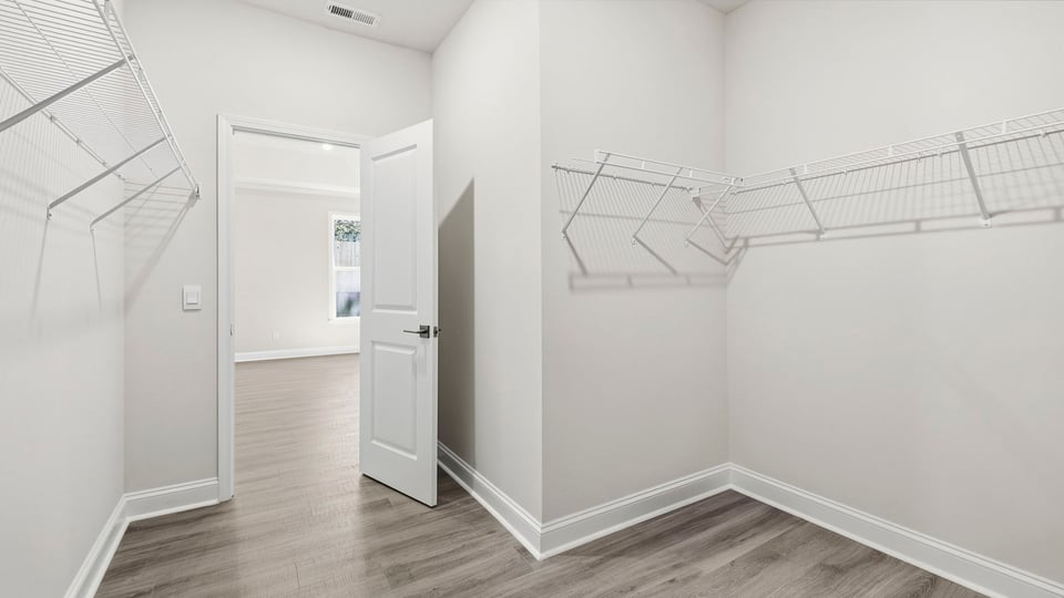 Closet with hanging storage racks.