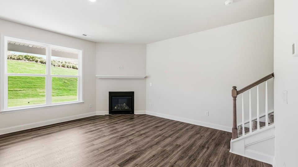 Living room with window and fireplace.
