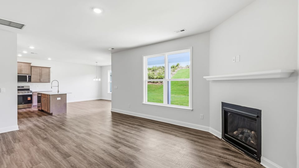 Living room with window and fireplace.