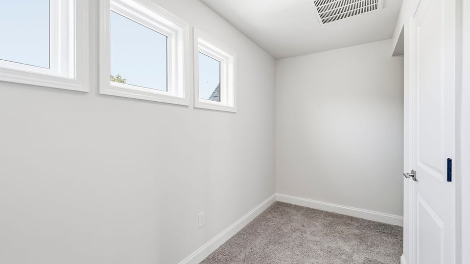Hallway upstairs with carpet.