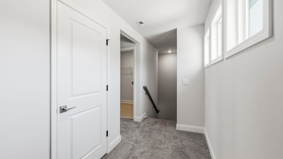 Hallway upstairs with carpet.