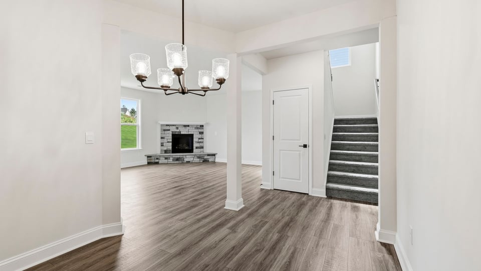 Living room with windows and fireplace.