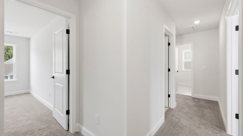 Loft area with carpet.