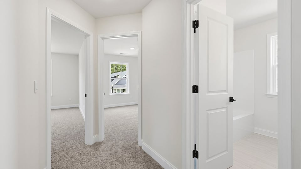 Loft area with carpet.