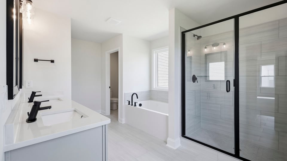 Bathroom with walk in shower and bathtub.
