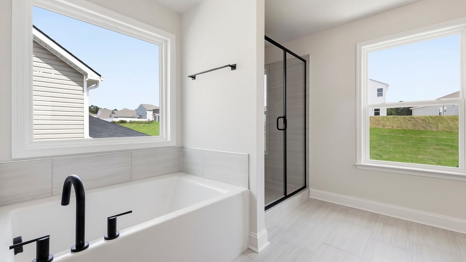 Bathroom with bathtub and window.
