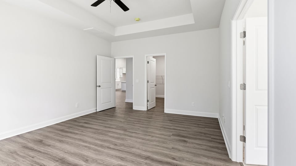 Bedroom with carpet and window.