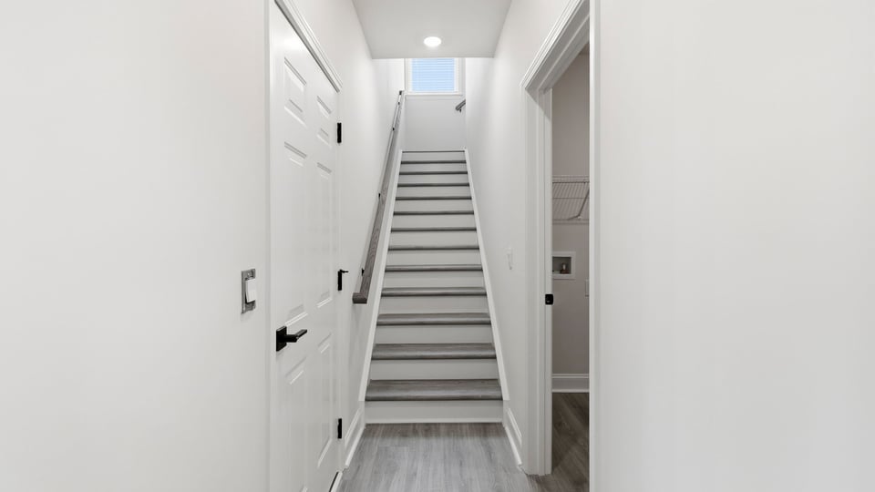 Stairs to additonal bedrooms.