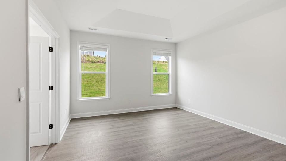 Bedroom with carpet and window.
