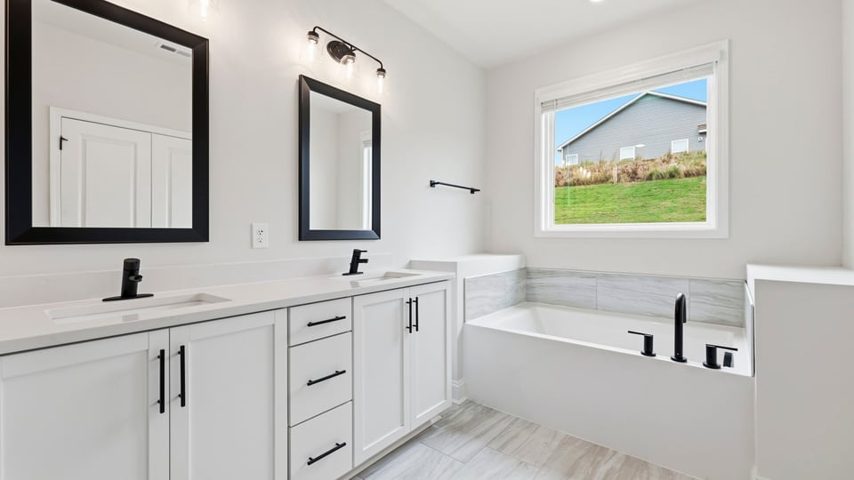 Bathroom with bathtub and window.