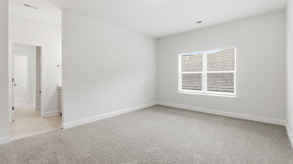 Bedroom with carpet and bedroom.