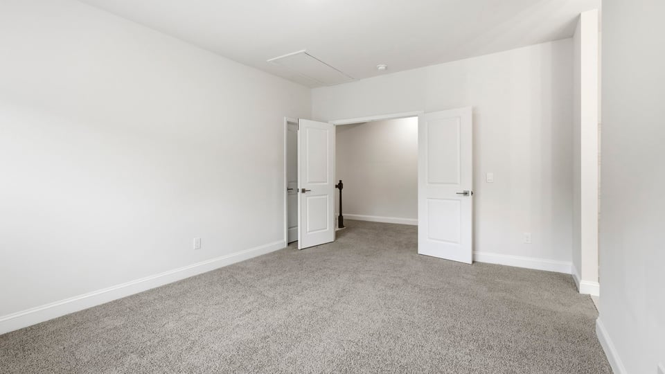 Bedroom with carpet and bedroom.