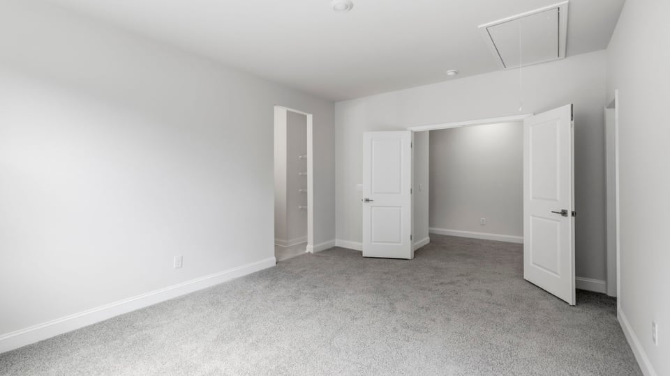 Bedroom with carpet and window.