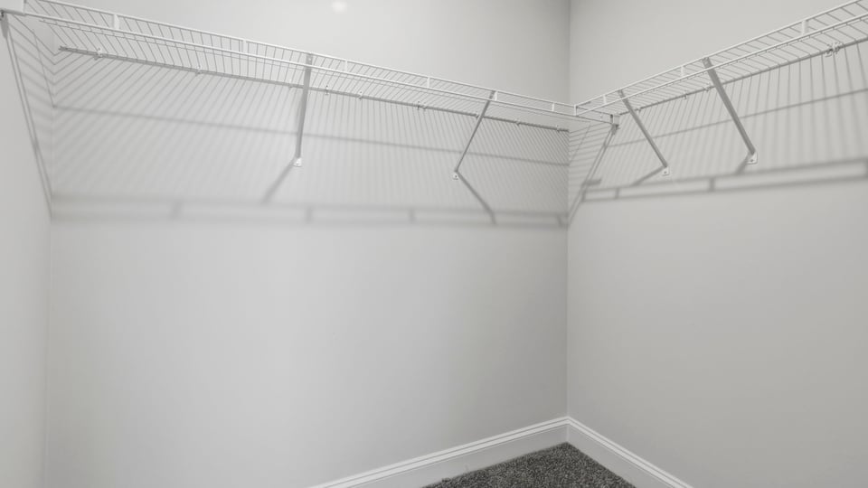 Closet with hanging storage racks.