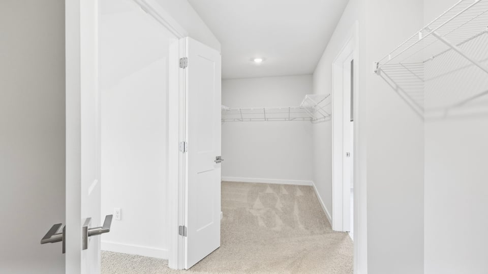 Closet with hanging storage racks.
