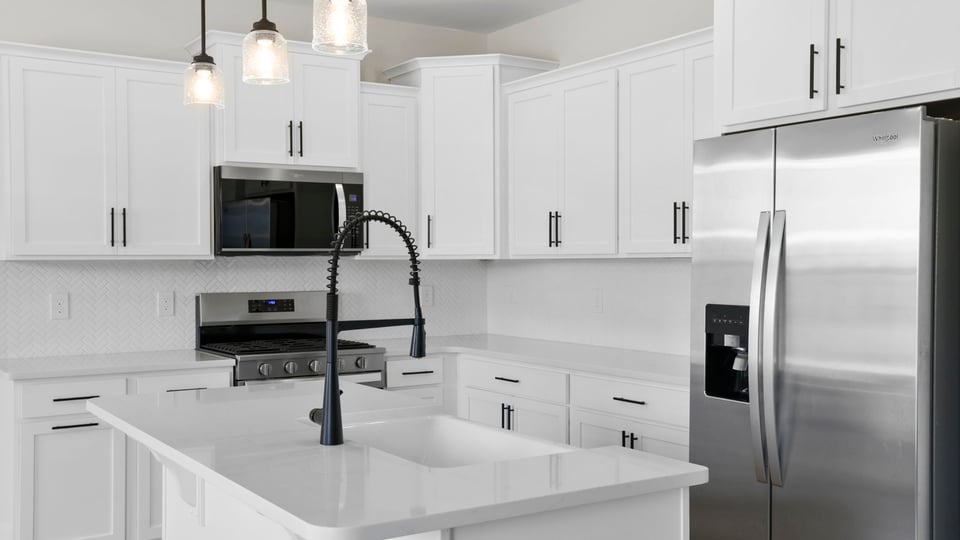 Kitchen with island and cabinets.