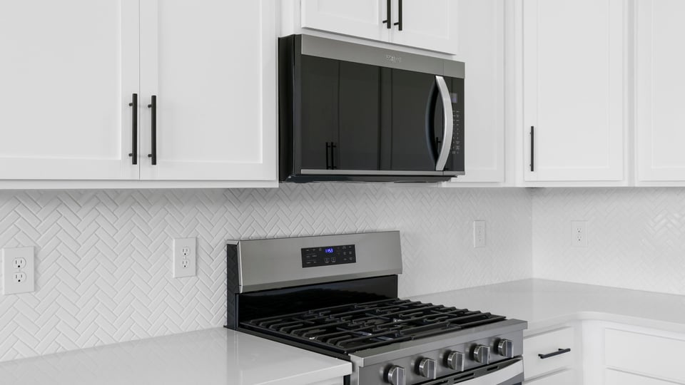 Kitchen with island and cabinets.