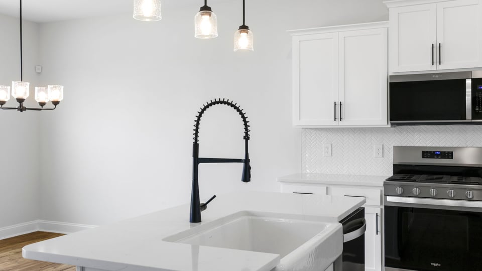 Kitchen with island and cabinets.