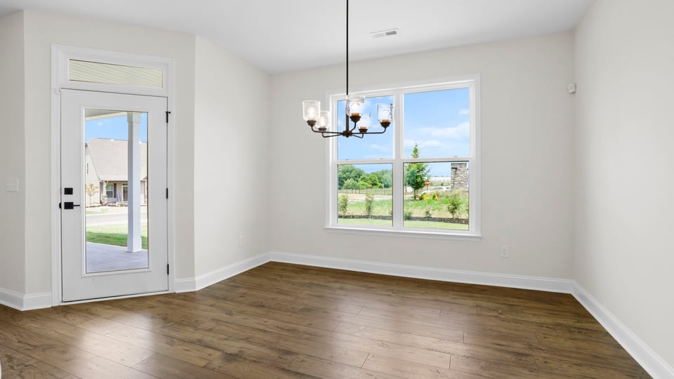 Living area with windows and fireplace.